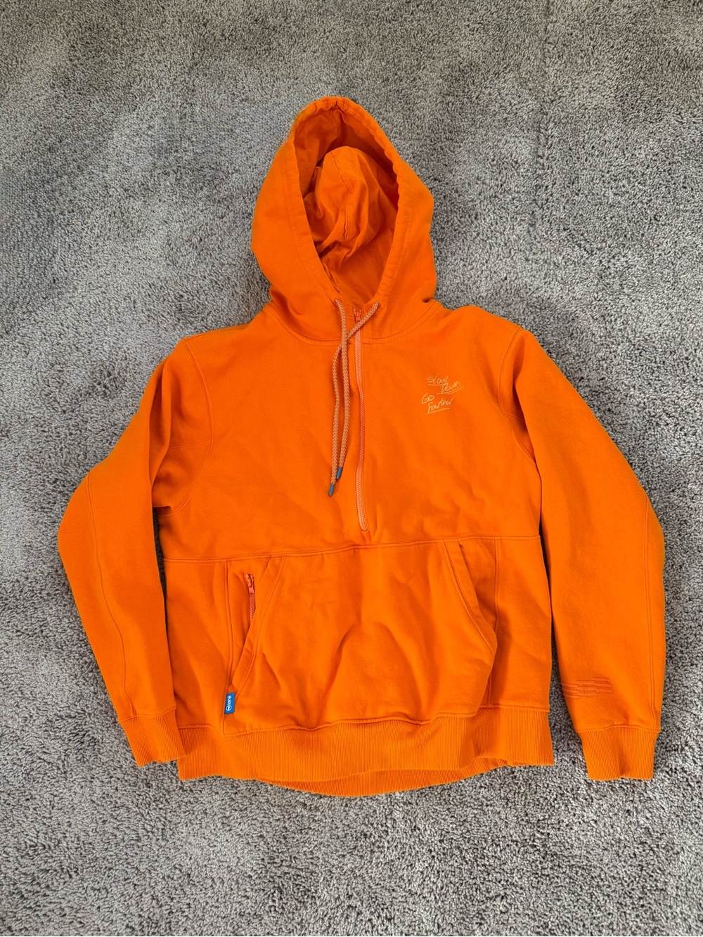 Janji Runaround Half Zip Hoodie Orange with Graphic on front and back